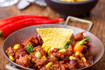 chili con carne on wood