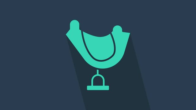 Turquoise Wild west saddle icon isolated on blue background. 4K Video motion graphic animation.
