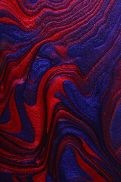 Vertical shimmer blue and red abstract background. Make up concept.Beautiful stains of liquid nail laquers.Fluid art,pour painting technique.Good for placing text or logo.