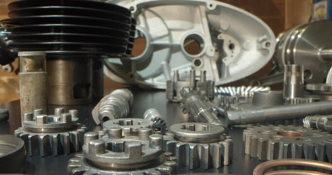 Motorcycle engine rebuild disassembled parts in garage workshop macro probe lens