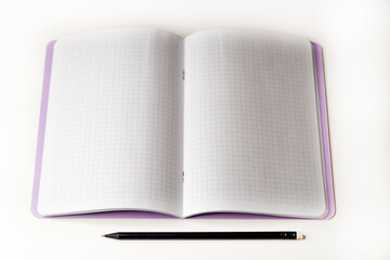 Open notebook and black pencil on a white background.