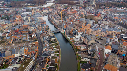 Obraz premium Aerial view of the Dender river crossing the Flemish city of Dendermonde