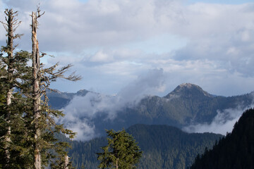 Looking down into a cloudy valley from a high mountain