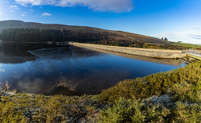 Thin ice on Fofanny reservoir and dam, Mourne mountains, County Down, Northern Ireland, panorama