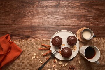 tasty chocolate dessert with coffee and almond milk on a rustic table