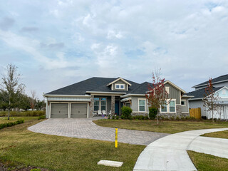 A luxury gray house in the Laureate Park neighborhood