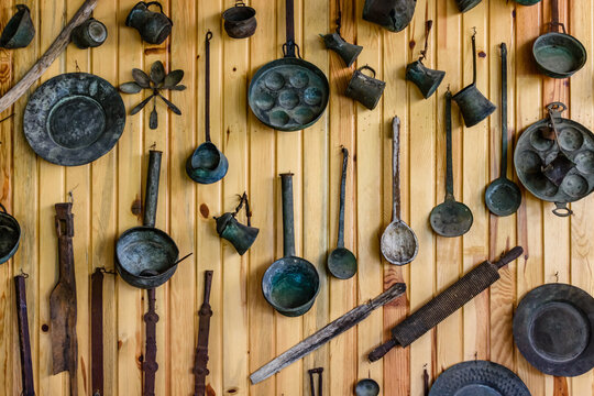 Ancient kitchen utensil hanging on wall. Kitchenware of the yoruk tribe