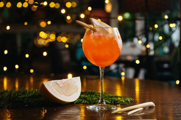 aperol spritz cocktail with pomelo on the table in restaurant