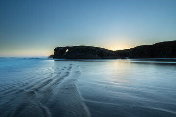 Sunrise at one of the most famous beaches in Spain, Las Catedrales!