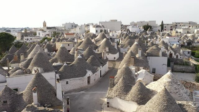 Alberobello, Italy. Fascinating view of the roofs of Alberobello's trulli. Neat rows of traditional buildings within narrow lanes. High quality 4k footage