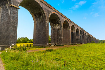 Fototapeta na wymiar A close up view along the side of the Harringworth railway viaduct, the longest masonry viaduct in the UK