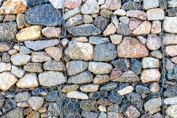 Stone wall with metal grid as background