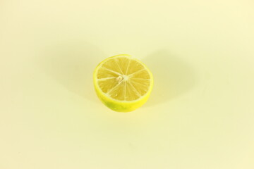 sliced lemon in cream color background