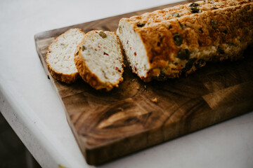 fresh olive bread on a wooden plate