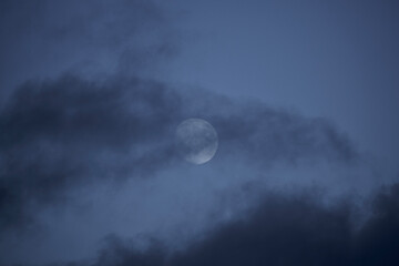 Moon in the cloudy sky