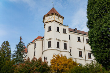 Fototapeta na wymiar Historic Medieval Konopiste castle residence of Habsburg imperial family, white tower and park of romantic gothic baroque Chateau in autumn sunny day, Central Bohemia, Czech Republic,