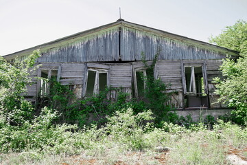 Fototapeta na wymiar Old deserted wooden farm house. Abandoned house.