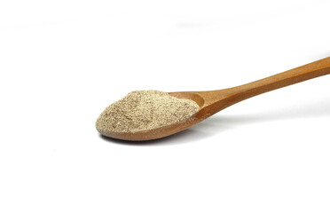 Spice of white pepper isolated on white background. Ground white pepper spilled on a white background.