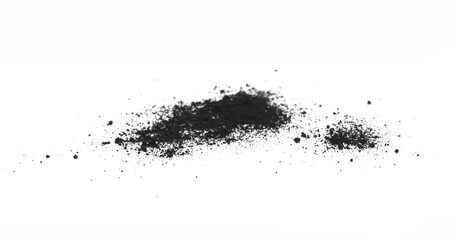 Black powder (Charcoal powder) scattered. Isolated on white background. A loose heap of fine...