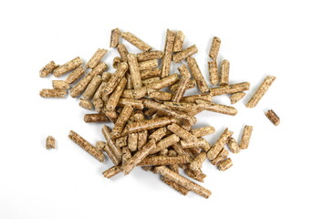 Close up on a pile of compressed wood pellets for use as an eco-friendly renewable organic biofuel or mulch in the garden over a white background