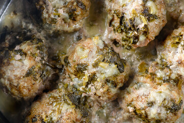 Obraz na płótnie Canvas Hommade roasted delicious meatballs in cream sauce. Close up view.