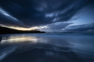 Winter sunset with reflections of clouds on the beach of Las Islas!