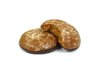 Glazed gingerbread lebkuchens with chocolate isolated on white. German round gingerbread called...