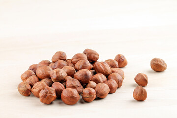 A pile of hazelnuts without shells. Healthy food.