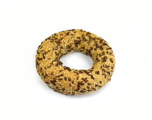 Fullgrain bagel with seeds isolated on white background. Fresh breakfast bread bagel roll with seeds isolated on white background.