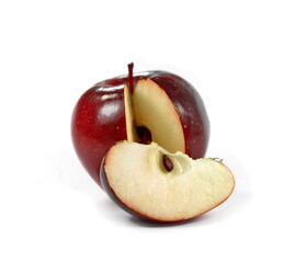 Dark Red apple and cut piece isolated on white.