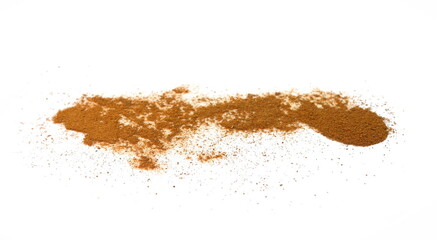 Spice cinnamon powder isolated on a white background. Cinnamon powder spilled on a white surface.