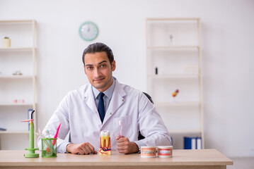 Young male doctor stomatologist working in the clinic