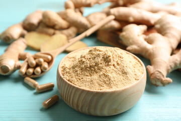 Dry, capsuled and fresh ginger on light blue wooden table, closeup