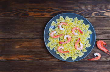 italian dish noodles with seafood, shrimp pasta, mediterranean cuisine top view
