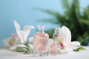 Fototapeta na wymiar Beautiful spa composition with essential oil on white table, closeup