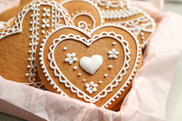 Tasty heart shaped gingerbread cookies in box, closeup