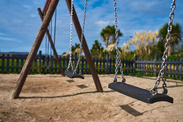 Empty swings in playground