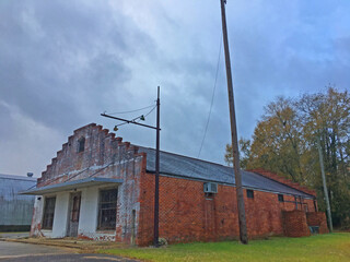 Old abandoned brick building and cloudy sky