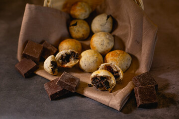 Baked cheese bread with chocolate filling, placed inside a wicker basket