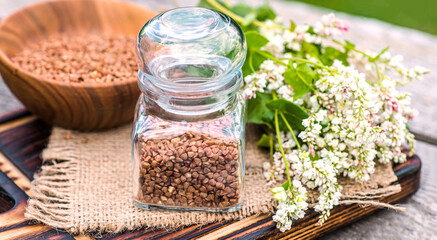 Transparent jar for loose products with dry buckwheat.
