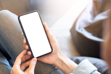 cell phone blank white screen mockup.woman hand holding texting using mobile on desk at office.background empty space for advertise.work people contact marketing business,technology
