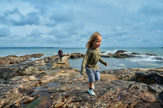 Preschooler on jetty byu the sea
