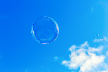 soap bubble flying in front of the sky