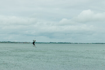 kitesurfer flies across the sky of the North Sea in Germany