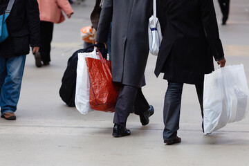 Fototapeta na wymiar men with shopping bags in the city