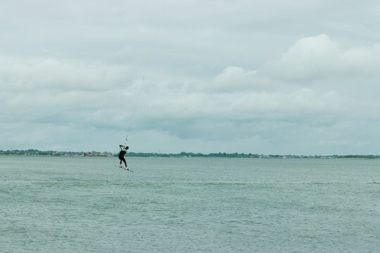kitesurfer flies across the sky of the North Sea in Germany