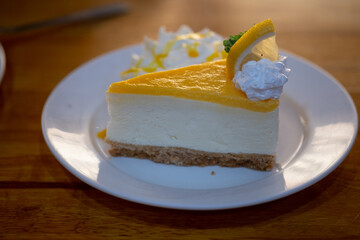 Slice of cheesecake with lemon.