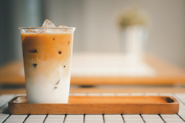 Tasty iced latte coffee in glass