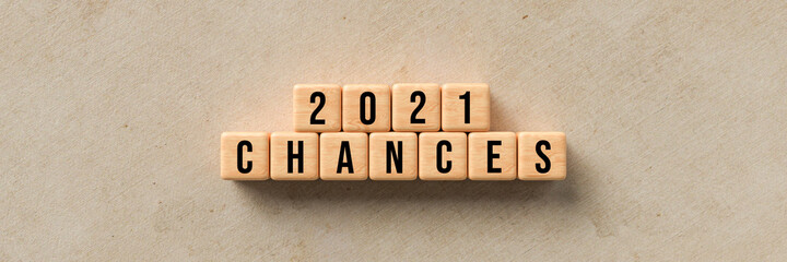cubes showing the message 2021 CHANCES on paper background