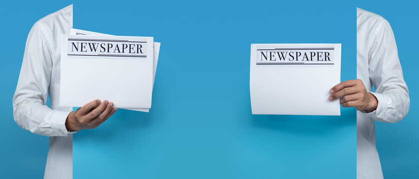 Male Holding Blank Business Newspaper On Blue Background,copy Space For Text